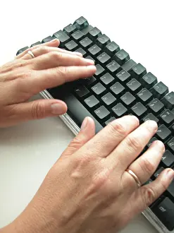 Electronic Communication Tools Imprime: Hands at computer keyboard