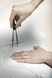 Construction Project Planning Imprime: Hands of engineer working on a construction plan