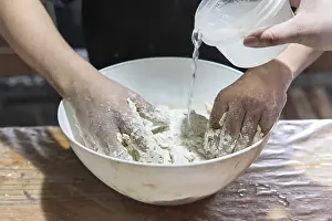 Bread Dough Preparation Imprime: Detail of hands preparing dough for baking bread