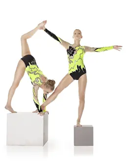 Circus Artist Training Imprime: Two high skill acrobats exercise program on cube isolated