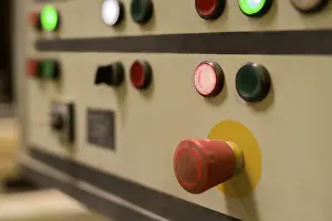 Industrial Building Interior Imprime: Image of red switch on remote control panel