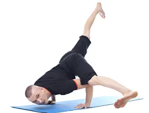 Gymnastics Training Photos Imprime: Image of yogi posing in studio looking at camera