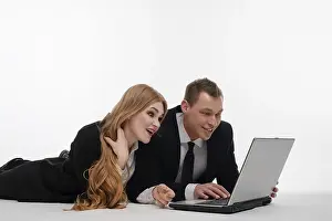 Teamwork And Technology Imprime: Two individuals engaged in a collaborative activity