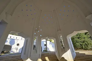 Kallithea Thermal Baths Imprime: Interior of a dome-shaped structure with blue light patterns and step-like elements