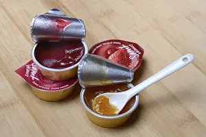 Portion Pack Jam Imprime: Jam in portion pack with spoon, jam