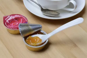 Environmentally Friendly Packaging Imprime: Jam in portion pack with spoon, jam