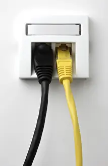 Electrical Wire Imprime: LAN cable, network cable in a socket
