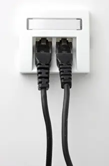 Electrical Wire Imprime: LAN cable, network cable in a socket
