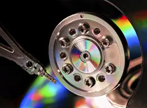 Electronic Data Storage Imprime: Macro of an open computer hard drive with the read write head