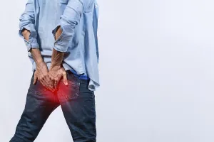 Hemorrhoid Problem Imprime: Man with digestive problem touching his buttock