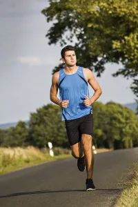 Recreational Activity Imprime: Man jogging through the fields