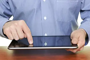 Tablet Pc Usage Imprime: Man using a tablet computer