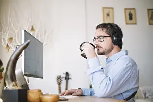 Modern Office Architecture Imprime: Man working computer drinking