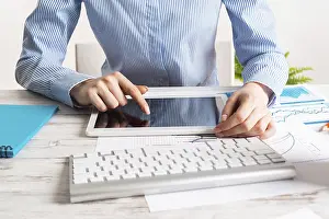Business Accounting Imprime: Manager using tablet computer with blank screen