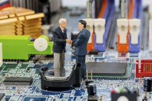 Printed Circuit Board Image Imprime: Two managers on computer board