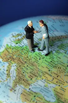 Business Executives Imprime: Two managers on one globe. Globalisation