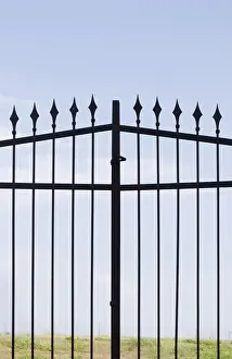 Abandoned Entrance Gate Imprime: A metal gate with sharp spears