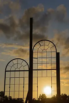 Northern German Landscapes Imprime: Two metallic window frames stand out against the dramatic sunset sky
