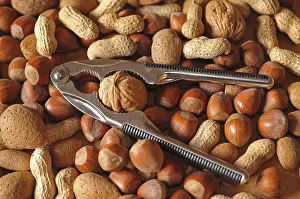Mixed Nuts Imprime: Mixed nuts with a nutcracker