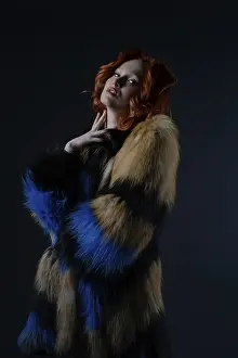 Fashionable Female Imprime: Model stands gracefully in a studio