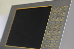 Automated Manufacturing Process Imprime: Monitor with touch-sensitive buttons on machine