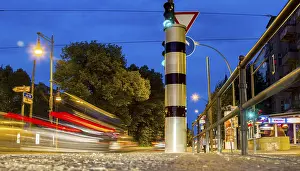 Road Safety In Europe Imprime: Moving trams at an intersection with a speed camera column