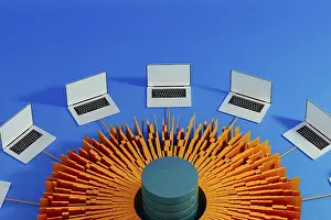 Artificial Intelligence Technology Imprime: Multiple laptops surround a central data hub
