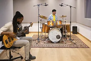 Musician Collaboration Imprime: Two musicians collaborating in a modern recording studio