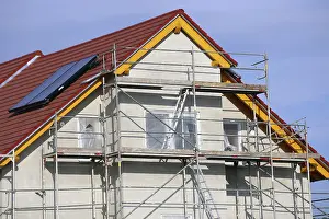 New Home Construction Process Imprime: New building with completed basic rendering of the exterior facade New building with completed basic rendering of