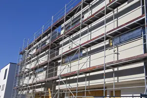 Residential Construction Site Imprime: New building with completed basic rendering of the exterior facade New building with completed basic rendering of