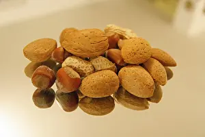Studio Shot Of Nuts Imprime: Nuts on a mirror