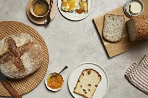 Wooden Table Breakfast Scene Imprime: Overhead view of a breakfast setting featuring rustic bread