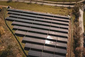 Power Generation System Imprime: Overview of solar modules in ordered formation with sunlight