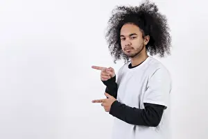 Hispanic Ethnicity Male Model Imprime: Pointing to the left at a copy paste space