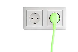 Ecological Conservation Image Imprime: Power socket with a green plug