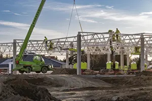 Industrial Construction Project Imprime: Professional construction crew using a telescopic handler