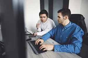 Computer Specialist Imprime: IT Programmer Working on Desktop Computer