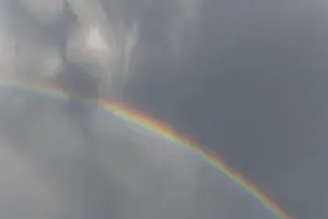 Springtime Alsace France Imprime: Rainbow appears in rain clouds in spring