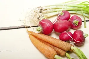 Vegan Nutrition Food Imprime: Raw root vegetable on a rustic white wood table