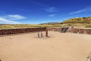 Ancient Civilization Sites Imprime: A rectangular square with stone pillars surrounded by ruins under a clear sky
