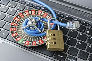 Secure Internet Connection Imprime: Roulette wheel, padlock and internet cable lying on computer keyboard symbolizing data encryption