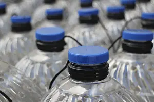 Environmental Issue Plastics Imprime: Rows translucent plastic bottles close to