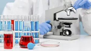 Female Scientist In Lab Imprime: Scientist checking substance with microscope