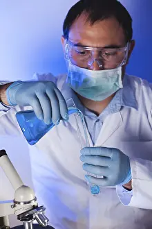 Test Tube Analysis Imprime: Scientist is doing research at the work