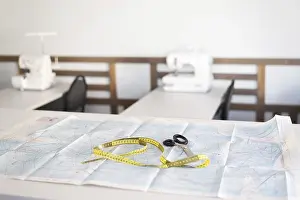 Sewing Workshop Imprime: A sewing workshop featuring essential tools including scissors