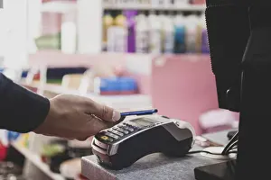 Online Shopping Payment Imprime: Shopper does payment using smartphone