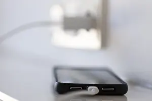 German Power Industry Imprime: A smartphone is charged via a socket
