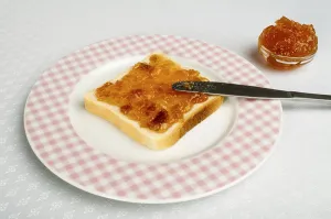 Homemade Breakfast Ideas Imprime: Spread jam on bread with knife
