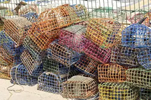Imágenes fechadas el 27 de agosto de 2024: Colorful fishing traps print harbor scene
