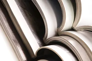 Waste Management Practices Imprime: Stack of open magazines